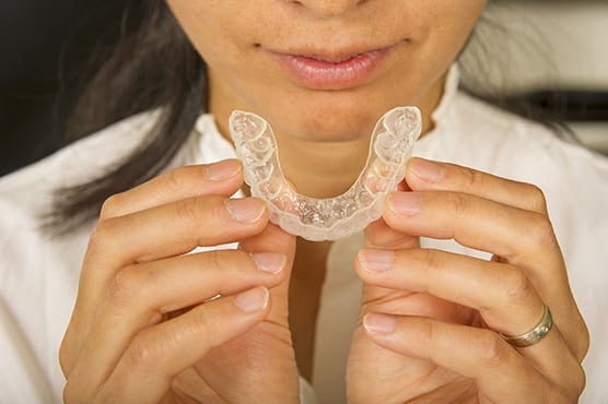 A women has a mouthguard